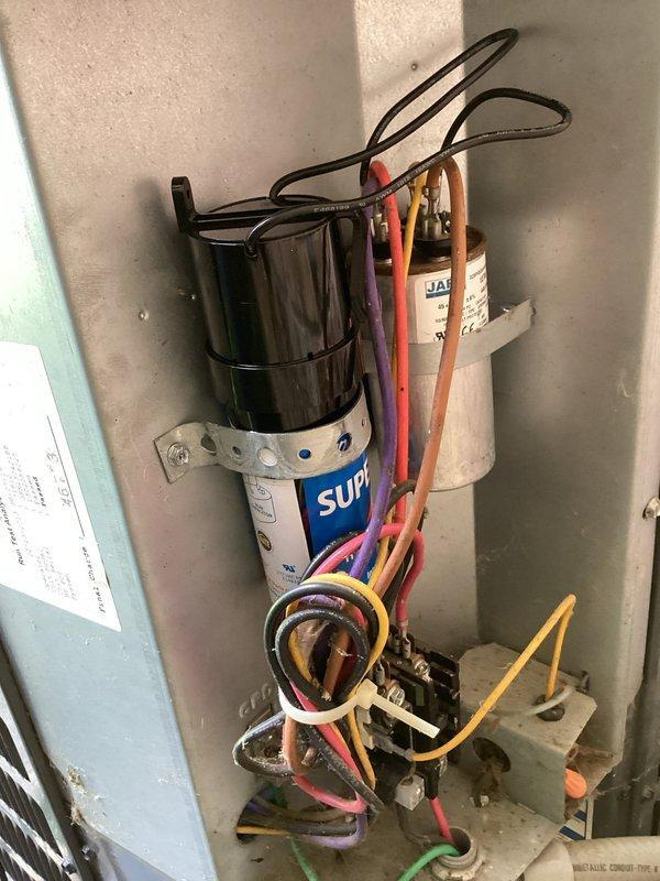 Completed scheduled air conditioning maintenance on Goodman outdoor condensing unit. Performed comprehensive system inspection including electrical components, capacitor testing, and visual assessment of condenser coil and fan operation. Verified proper electrical connections within control cabinet, checked SUPCO capacitor functionality, and confirmed all wiring connections were secure. Inspected outdoor unit exterior condition, cleared debris from base area, and ensured adequate airflow around unit. System operating within normal parameters upon completion of maintenance service.
