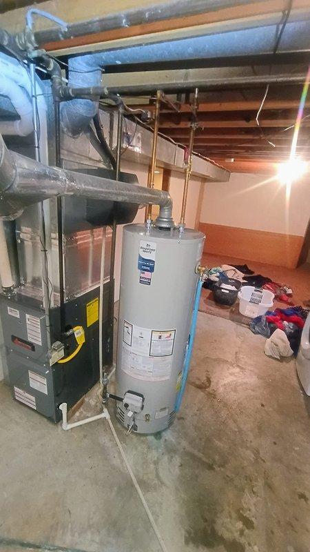 Elkhart, IN - Successfully removed and replaced existing 40-gallon residential water heater with new Bradford White unit in basement utility area. Installation included proper connections to existing copper supply lines, gas line hookup, venting configuration, and temperature-pressure relief valve installation per manufacturer specifications and local code requirements.