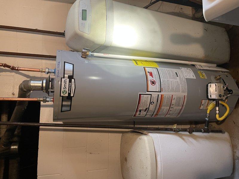 Elkhart, IN - Completed residential water heater replacement with A.O. Smith tanked unit, including installation of expansion tank, connection of gas supply line with flexible yellow connector, and integration of all necessary copper supply and discharge piping. All components tested and verified operational with proper venting, temperature/pressure relief valve installation, and code-compliant clearances maintained throughout the installation.