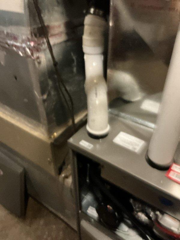 Successfully installed a Lennox ML196UH070 furnace with 16x25x1 filter elbow and T4 thermostat in customer's utility area. Completed proper ductwork connections with seam tape at joints and installed PVC drain piping. System is operational with all components properly secured and labeled.