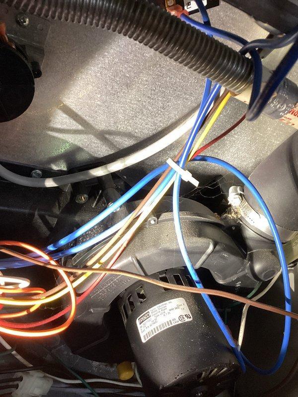 Responded to no cool call for 8+ year old system where customer reported burning smell and no warm air. Inspected unit (model PGF1RC060C12B) and found issue with electrical components. Inspected wiring connections and blower motor assembly, which were the likely source of the burning odor. Restored system operation and verified proper cooling function.