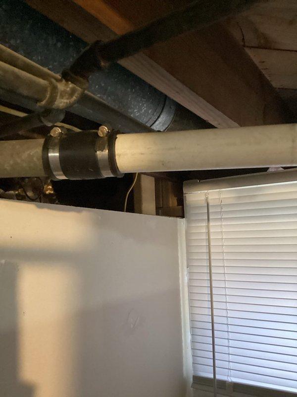 Removed existing toilet and replaced with new American Standard ADA Cadet Pro right height model. Cut out and replaced damaged section of bathroom subfloor, installed new closet collar. Replaced deteriorated stack in basement by cutting out section from floor joist to laundry sink tie-in, installing new PVC stack with proper connections to existing vent, shower drain, up-flush toilet and kitchen drain line. All waste materials were hauled away after successful testing of the new installation.