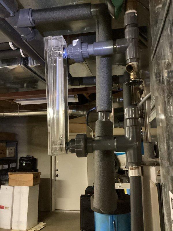 Completed D-1 repair as per approved quote on the CH heating system. Performed a comprehensive geothermal flush to optimize system performance. Flow meter readings were verified at 7.5 GPM and pressure differential was confirmed using Dwyer manometer to ensure proper circulation through the insulated PVC piping network.