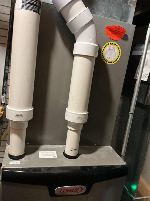 Diagnosed issue with 6-year-old Lennox furnace that was blowing cold air despite customer replacing thermostat batteries. Determined system was actually operational with green indicator light illuminated. Performed comprehensive inspection of the furnace, verified proper intake/exhaust ventilation through PVC piping, and confirmed heating functionality. Reset thermostat which resolved the "low battery" warning.