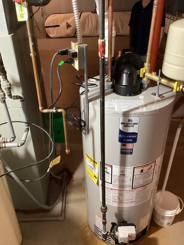 Successfully installed a new Bradford White water heater according to the approved estimate. Installation included proper connection of all copper and PVC piping, mounting of an expansion tank, and installation of appropriate shut-off valves. System was verified to be in good working condition with no leaks.