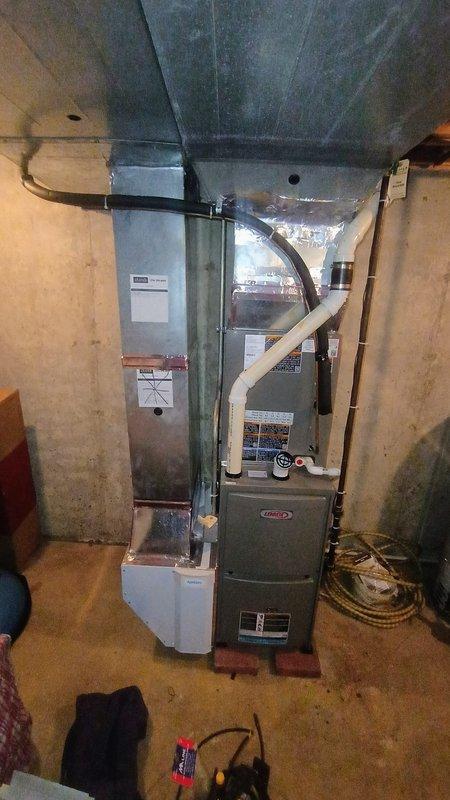Completed removal and replacement of existing Marlo water softener system in basement utility area. Installation included new softener tank with digital control head, connection to existing copper piping system, and proper disposal of old equipment. System was successfully started up and tested after installation.