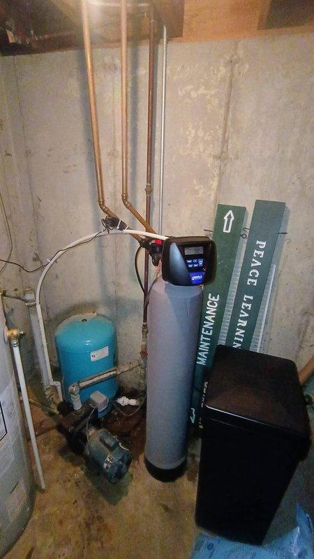 Completed removal and replacement of existing Marlo water softener system in basement utility area. Installation included new softener tank with digital control head, connection to existing copper piping system, and proper disposal of old equipment. System was successfully started up and tested after installation.