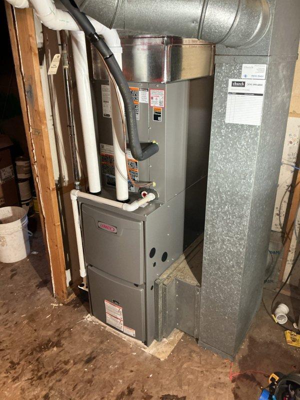 Successfully completed full HVAC system installation including Lennox ML196UH045 furnace, ML13KC1-024 condensing unit, CK40CT-30b cased coil, and AO Smith 40-gallon power vent water heater. Properly connected all components to existing return filter and thermostat, with outdoor unit positioned adjacent to foundation wall and all refrigerant lines properly installed.