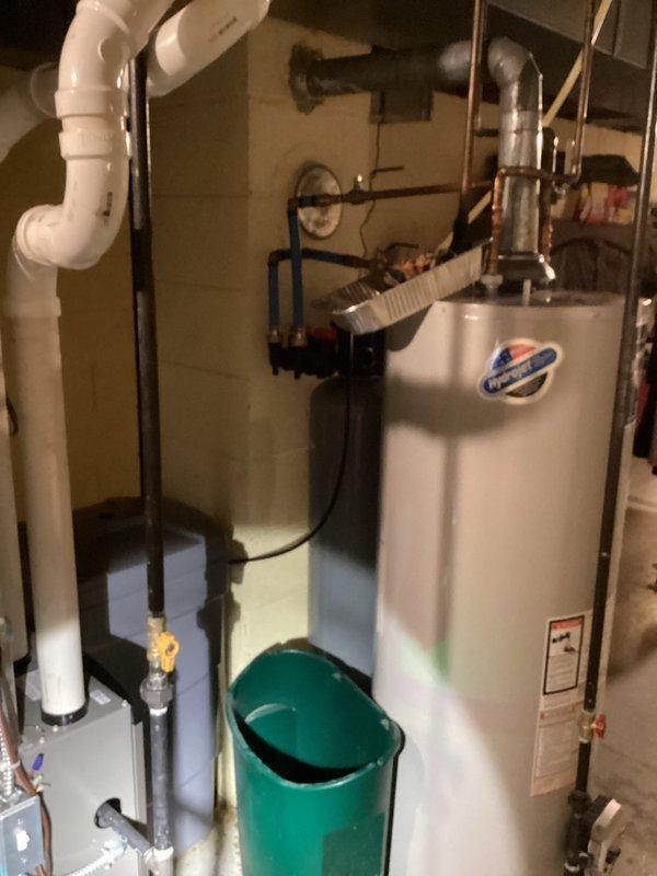 Responded to customer concern regarding copper pipe leak in water softener supply line. Visual inspection confirmed leak point in the plumbing assembly with orange valve handle. Replaced damaged section of copper pipe and restored proper water flow to softener system.