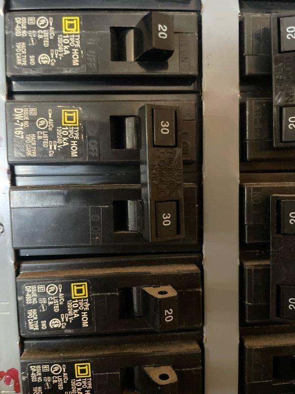 Cassopolis, MI - Conducted comprehensive assessment of electrical service panel to determine compatibility for proposed ductless HVAC system replacement. Identified multiple 20-amp and 30-amp Square D circuit breakers with some showing signs of wear, particularly noting discoloration on lower breaker housings. Customer expressed interest in ductless solution based on commercial advertising; system requirements and financing options were discussed during on-site consultation.