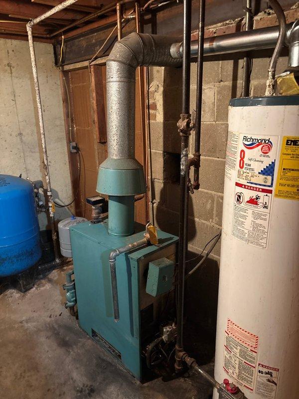 Performed comprehensive maintenance on aging furnace system including thorough cleaning of burners and burner box, adjustment of burners for optimal performance, and repair of compromised venting components. System testing revealed proper gas pressure readings after service, with all heating functionality restored to normal operation.