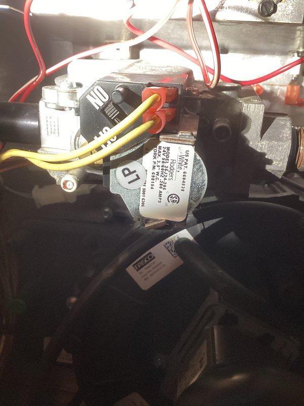 Niles, MI - Responded to callback for non-functioning furnace. Inspected gas valve assembly and control components, finding loose wire connections at the gas valve. Reconnected and secured all wiring connections, particularly focusing on the red and yellow control wires. System tested after repair with multiple heating cycles confirming proper operation.