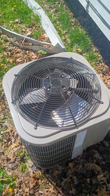 South Bend, IN - Installed protective fan guard on outdoor air conditioning condenser unit as specified in approved quote. Guard features metal wire mesh construction with radial spoke pattern, providing protection for condenser fan while maintaining proper airflow. Unit secured and operational upon completion.