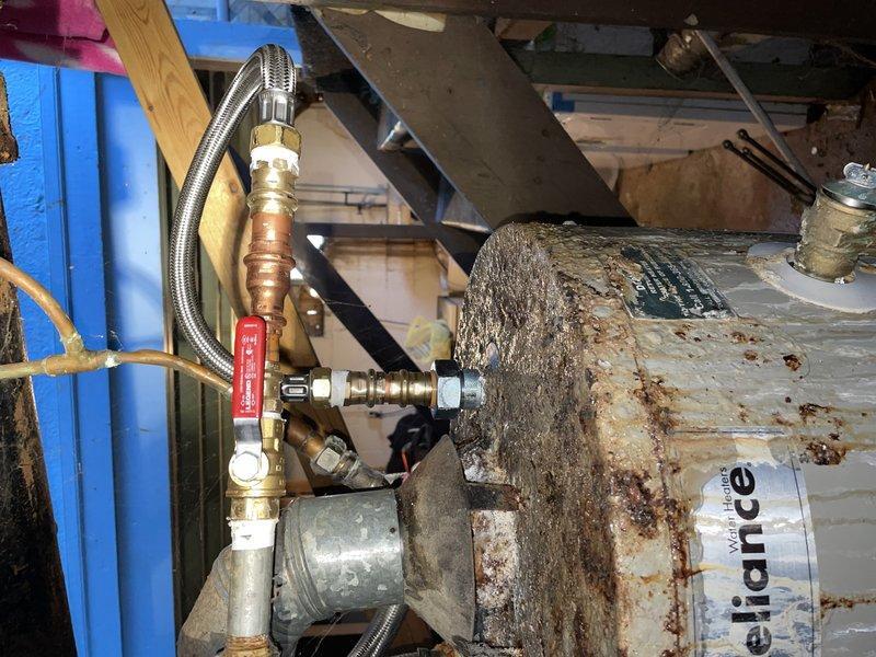 Performed maintenance service on a 6-7 year old tanked water heater upon customer request. Successfully completed water heater flush to remove sediment buildup and addressed a minor leak identified at the tank connections. Unit was operational at time of service, and all plumbing connections were inspected and secured using appropriate brass fittings and valves to ensure proper system integrity.