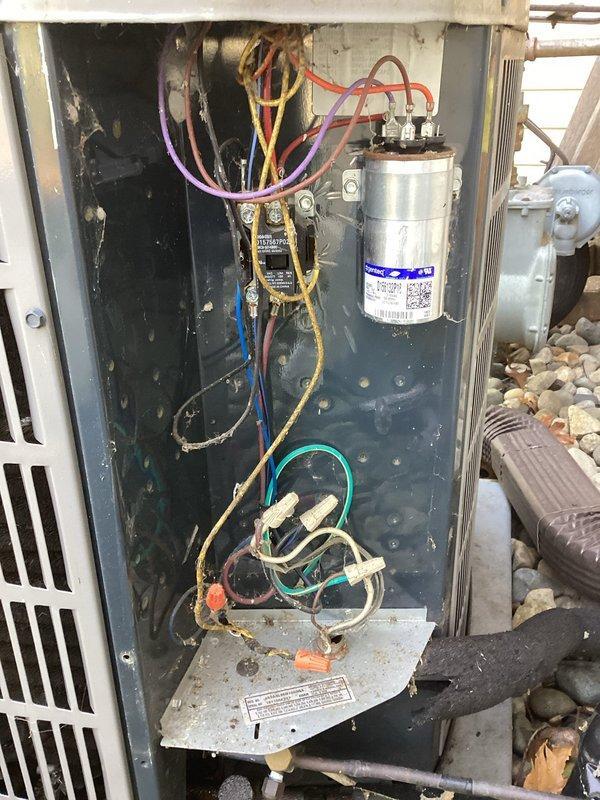 Completed scheduled air conditioning maintenance on residential outdoor condenser unit. Performed comprehensive system inspection including visual examination of electrical components, capacitor, contactor, and wiring connections. All components found to be operating within normal parameters with typical wear consistent with regular use. Unit exterior and internal compartment showed standard accumulation of dust and debris, which is expected for outdoor equipment. Documented system condition through photographic records showing capacitor specifications, electrical connections, and overall unit placement on concrete pad with proper clearances maintained. System operational and ready for continued service.