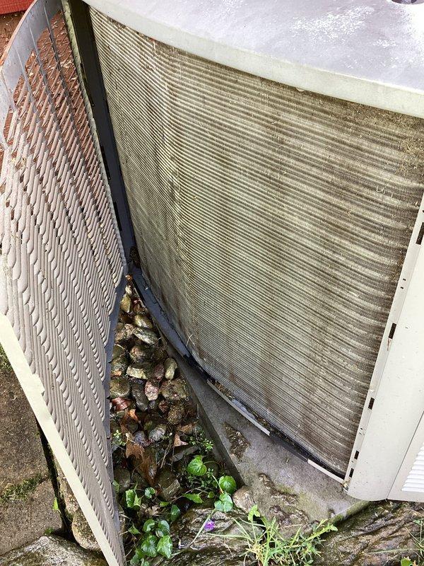 # HVAC Maintenance - Planned Single Maintenance

Completed scheduled air conditioning maintenance on residential Lennox condensing unit. Performed comprehensive system inspection including examination of condenser coils, electrical components, and refrigerant lines. Cleaned accumulated debris, leaves, and dirt from base of unit and surrounding area. Inspected heat exchanger coils which showed signs of weathering and dirt accumulation requiring attention. Verified proper operation of fan assembly and checked electrical disconnect box. Documented equipment condition through photographic evidence showing outdoor installation against wooden fence with PVC drainage line and electrical connections. Unit operational upon completion of maintenance service.