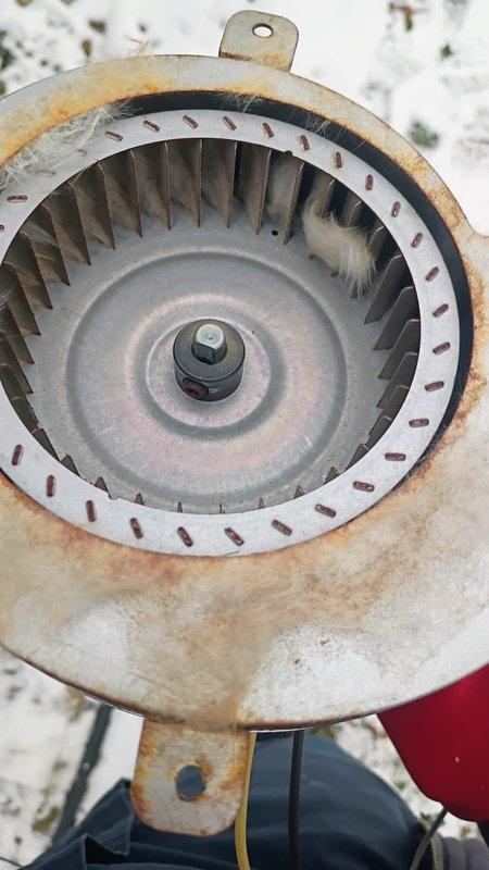 Bristol, IN - Responded to customer complaint of furnace turning off after 10 minutes while flame stays lit. Upon inspection, discovered severely corroded and rusted blower wheel causing operational failure. Replaced blower assembly to restore proper system function and heating capability. Home now maintaining adequate temperature.