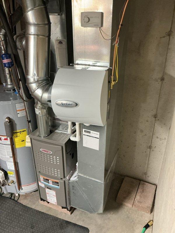 Successfully installed new Lennox ML180UH045 furnace with 600M humidifier and prepared for 1610 media filter installation. Connected system to existing thermostat and verified proper operation with temperature readings of 135° at supply duct. Complete system integration includes furnace, humidifier, and ductwork connections.
