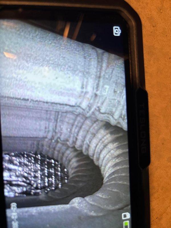 Responded to no-heat service call for 3-year-old furnace that was cycling off prematurely with timeout errors requiring breaker resets. Performed visual inspection of system components and used inspection camera to examine internal ducting. Diagnosed issue with flame sensor causing safety shutdown. Cleaned flame sensor, verified proper ignition sequence, and confirmed continuous operation through multiple test cycles. System now maintaining proper heat output with no timeout errors.