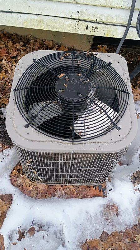 South Bend, IN - Performed inspection of outdoor condenser unit after customer reported gutter debris impact. Inspection revealed no structural damage to the unit, though minor debris accumulation was noted on fan grating and coil surfaces. Cleaned leaves and environmental debris from unit and verified normal operation of system.