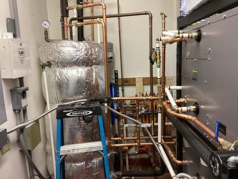 Responded to service call regarding water leak and gas leak concerns. Upon inspection of the mechanical room, examined complex plumbing system with copper and PVC piping network, pressure regulators, and associated valves. Identified and repaired leak in connection between copper supply line and pressure regulator valve, ensuring proper functionality of the building's water distribution system.
