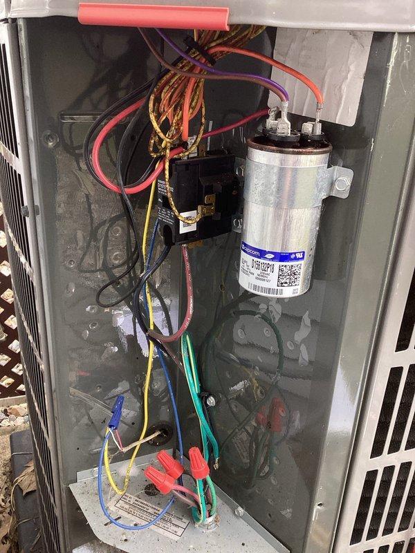 Performed routine maintenance on customer's outdoor AC unit. Conducted electrical diagnostics with multimeter to verify proper voltage and capacitance values. Inspected and cleaned interior components, noting the capacitor and electrical connections were in good working condition despite some dust accumulation. Unit is functioning properly with all parameters within manufacturer specifications.