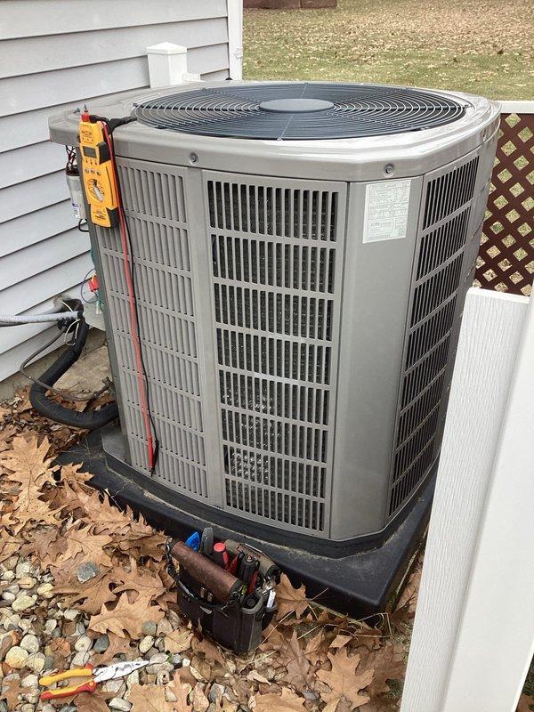 Performed routine maintenance on customer's outdoor AC unit. Conducted electrical diagnostics with multimeter to verify proper voltage and capacitance values. Inspected and cleaned interior components, noting the capacitor and electrical connections were in good working condition despite some dust accumulation. Unit is functioning properly with all parameters within manufacturer specifications.