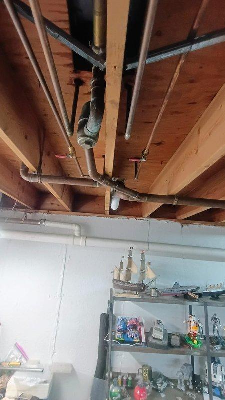 Responded to emergency service call for a customer who broke a fixture while attempting to replace a faucet, resulting in a water leak requiring complete water shut-off. Performed diagnostic inspection, taking measurements of the exposed pipe extension and examining the plumbing configuration in the ceiling joists to identify the proper repair solution. Successfully replaced the damaged fixture components, restored water service, and verified proper functionality with no leaks present.