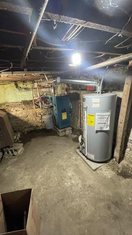 Goshen, IN - Completed installation of Burnham boiler system with four zone valves, including new water heater and chimney liner. Retrieved and installed required materials including 1" copper piping, 26ga pipe fittings, and press fittings. System was properly connected and tested for operation in basement mechanical room.