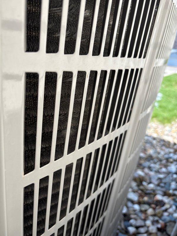 Performed scheduled maintenance on residential A/C unit with customer-supplied filters (20x20x4). Inspected outdoor condenser unit, confirming proper ventilation through grille and examining coil condition. Maintenance plan expires 4/26.