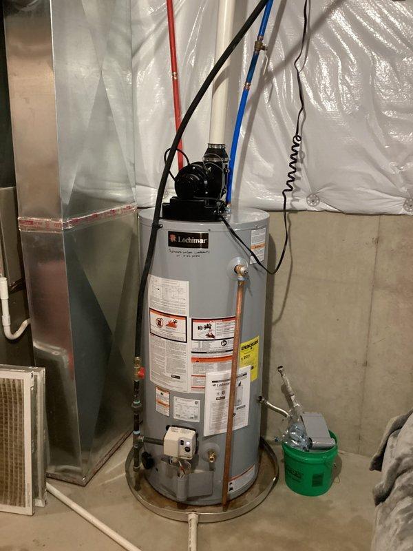 South Bend, IN - Completed water heater change-out with customer-supplied Lochinvar tanked unit. Installation included proper electrical connections, copper piping hookup, drain pan placement, and verification of all safety specifications per manufacturer requirements.