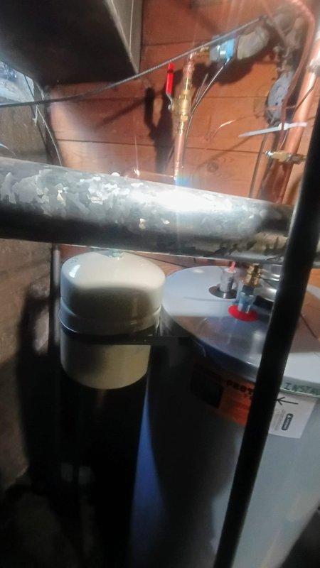 Responded to service call for 12-year-old water heater with pilot light failure and minor water leakage at base. Removed and disposed of failed unit, then installed new A.O. Smith tanked water heater with proper venting and connections to existing plumbing infrastructure. Tested all connections for leaks, verified proper combustion and pilot operation, and confirmed system functionality before completing installation.