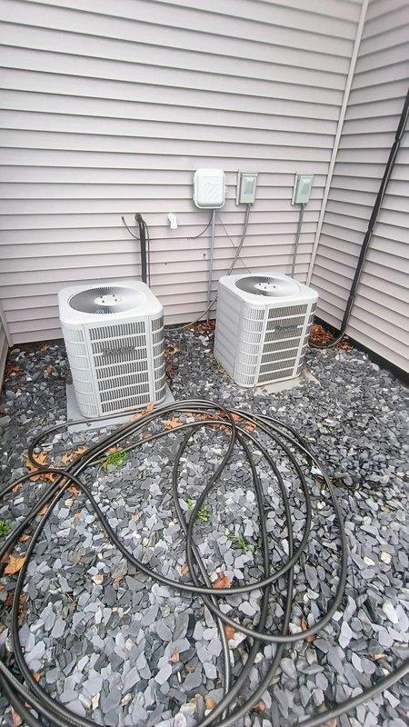 Responded to no cooling complaint on 9-year-old residential air conditioning system. Performed comprehensive leak detection inspection on outdoor condenser units and indoor air handler components. Located refrigerant leak in system, documented equipment condition with photographic evidence of dual outdoor units and attic-mounted air handler with associated ductwork. Provided customer with repair options including leak repair and system recharge based on refrigerant type and equipment age, along with cost estimate for necessary repairs to restore cooling functionality.