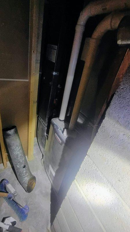 South Bend, IN - Completed comprehensive duct cleaning service for residential HVAC system. Performed thorough cleaning of ductwork connected to furnace unit, removing accumulated dust, debris, and contaminants from supply and return air pathways. Service fee was waived per quote agreement, and documentation photos were captured showing the furnace, connected ductwork, and utility room workspace before completion.