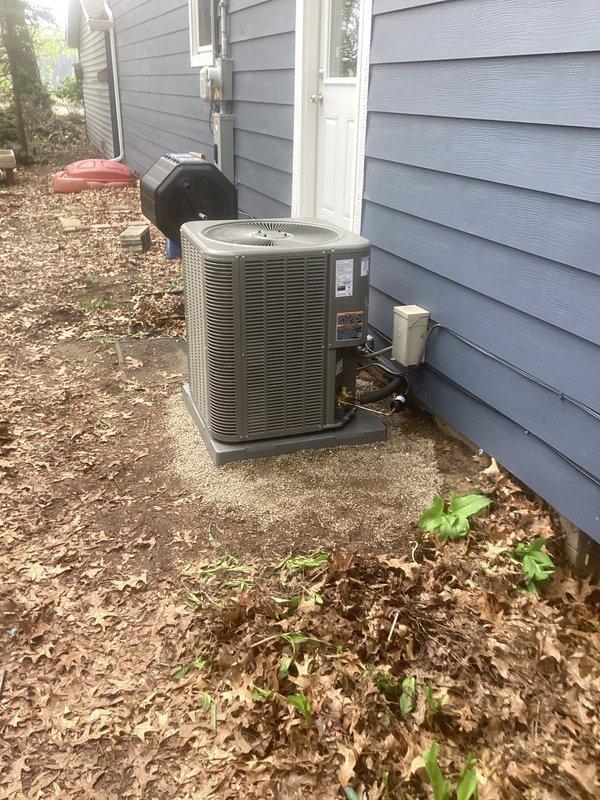 Completed installation of Lennox ML13KC1-036 condenser unit and CK40CT-30B cased coil on new concrete pad. Unit positioned on exterior wall with proper clearances, electrical disconnect installed, and refrigerant lines connected. System charged to manufacturer specifications using precision scale, reconnected to existing thermostat, and verified proper operation of all components.